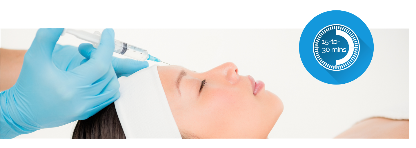 a woman is getting a facial filler injection